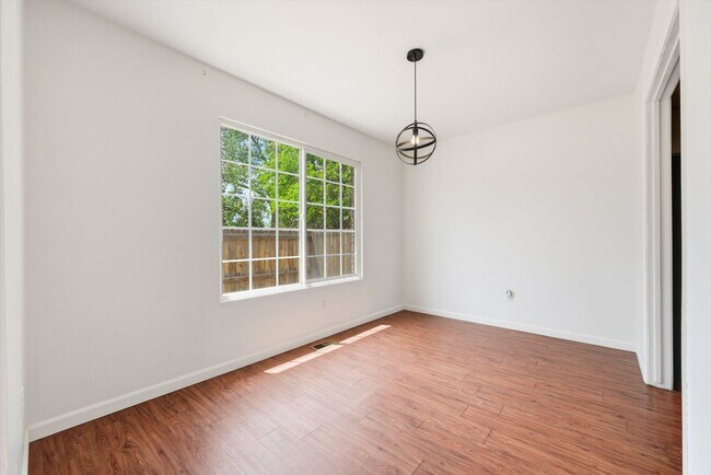 Building Photo - Spacious 4-Bedroom Townhome Backing to Open Space – Attached 2-Car Garage!