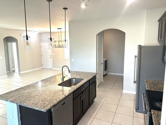 Building Photo - Available Now!! NW CAPE CORAL 3 BEDROOM 2 BATHROOM 2 CAR GARGAGE