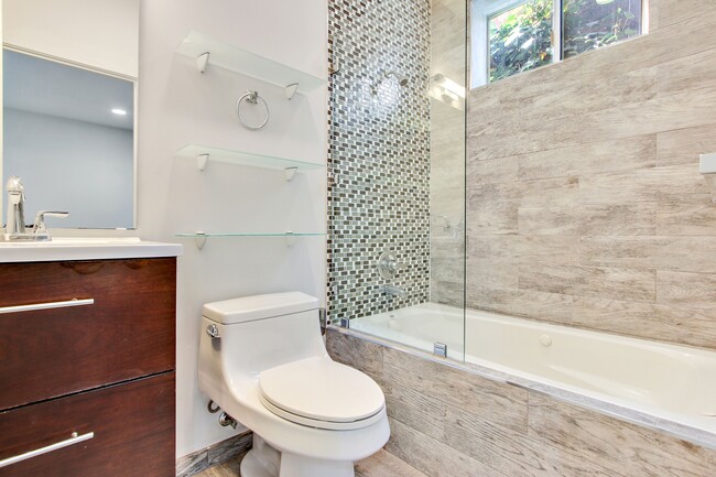 full bathroom downstairs inside of the bedroom. - 8725 Lookout Mountain Ave