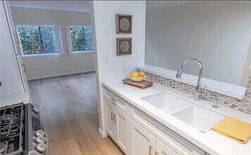 Building Photo - Located on a quiet, tree lined street in t...