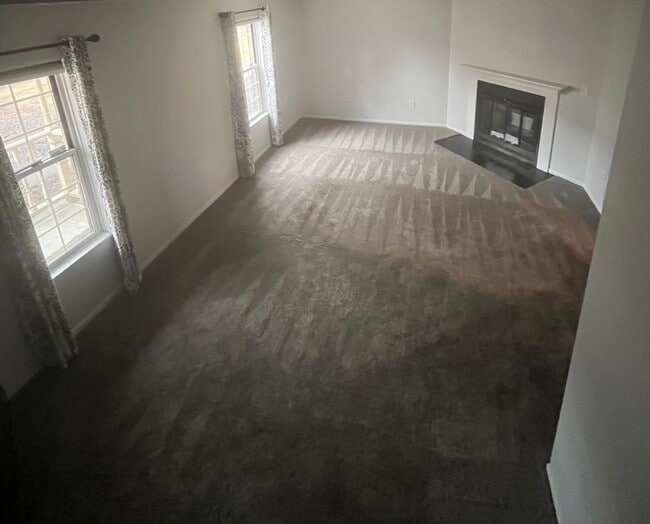 Living room with wood-burning fireplace - 1172 Worthington Woods Blvd