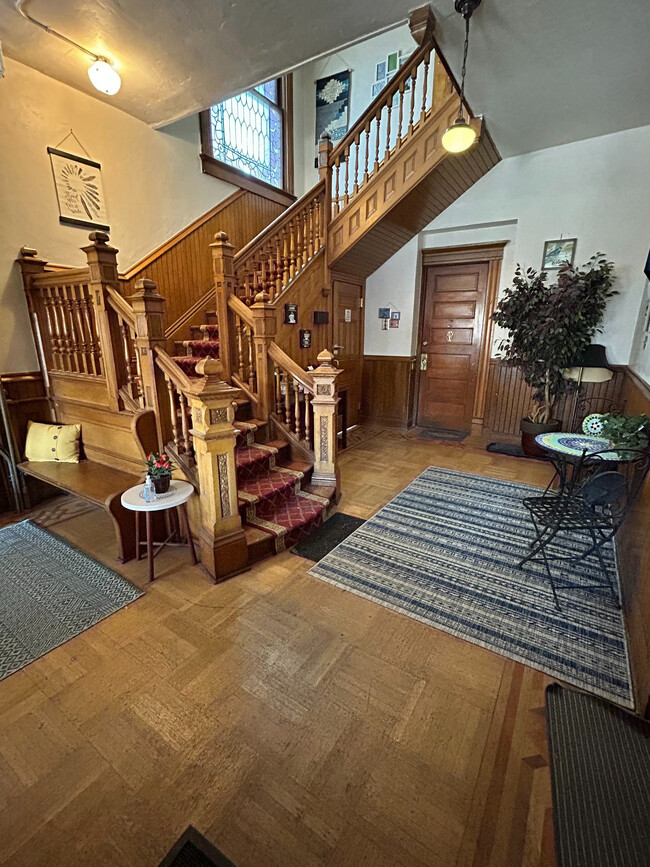 Experience timeless charm with this beautifully crafted wooden staircase, a perfect blend of elegance and warmth. - 1458 N Gaylord St