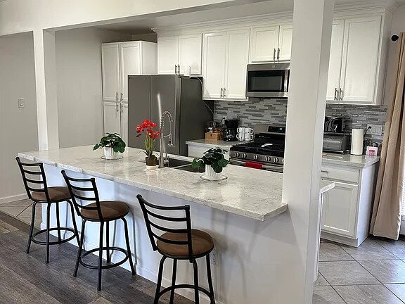 Building Photo - This beautifully remodeled 3-bedroom, 2-bathroom home is designed with an open concept layout