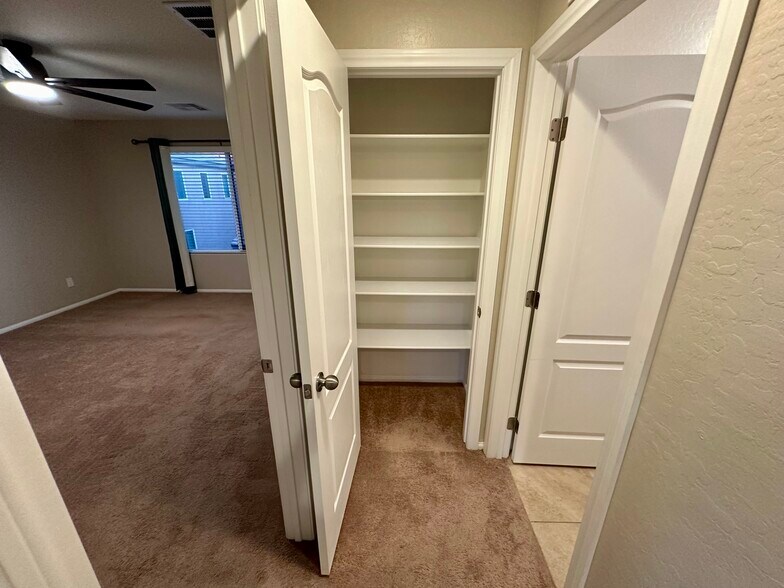 Closet in between Master Bedroom & Laundry Room - 9341 W Pearblossom Sky Ave
