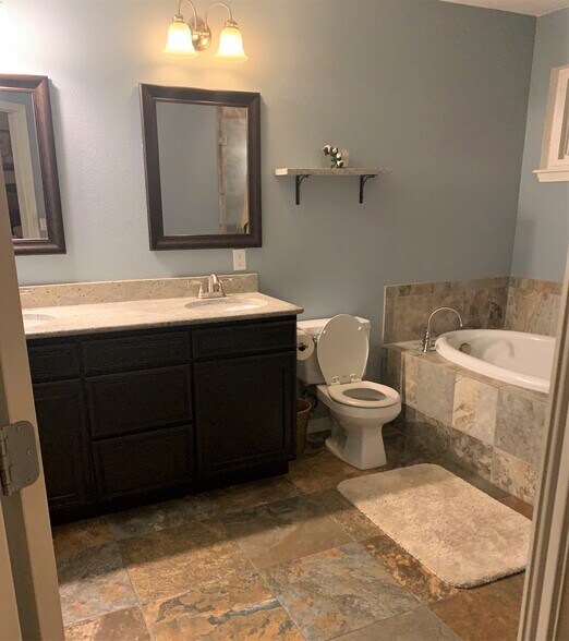 Master Bathroom - Double Sinks; Tub and Large Shower with Seat; Natural Light During the Day - 5736 S. Garland Way