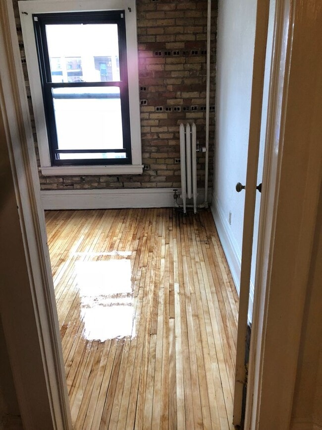 Building Photo - Downtown  2 bedroom Condo across from  St. Thomas close to MCTC, UMN, MCAD . New hardwood floors