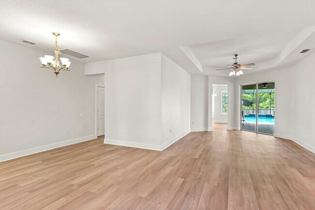 Building Photo - Expansive 4 bedroom, 3 bath remodeled home in gated community