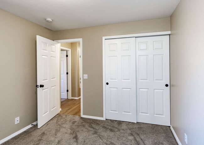 Building Photo - 3 Bed Top Floor Condo near Ft. Carson in Gated Community with detached Garage