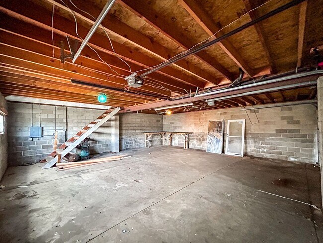 Building Photo - Spacious 5-Bedroom Home with Lofted Garage