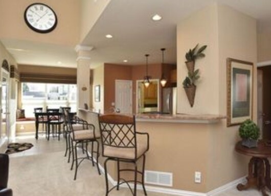 A view of open kitchen and informal dining in background. - 429 Beaver Point