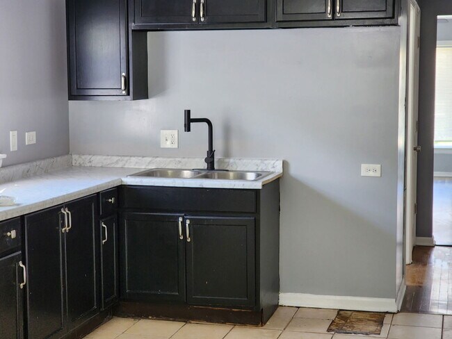 Building Photo - 7511 S Emerald Ave