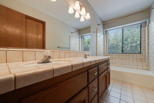 Building Photo - Bright and Stylish 4BD/2BA Home with 3 Car...