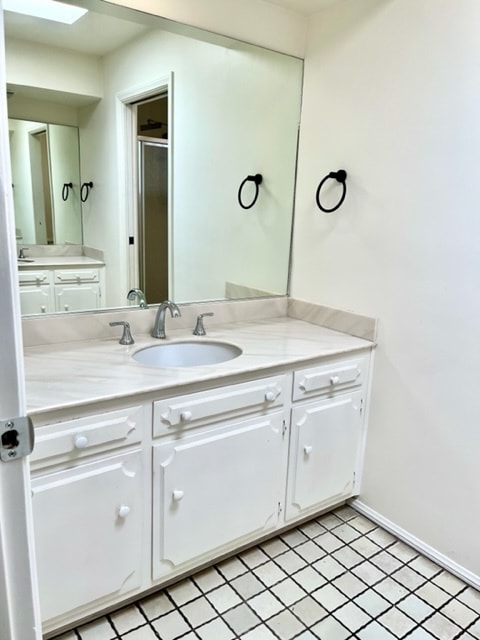Primary bath dual vanities - 1115 S La Peer Dr