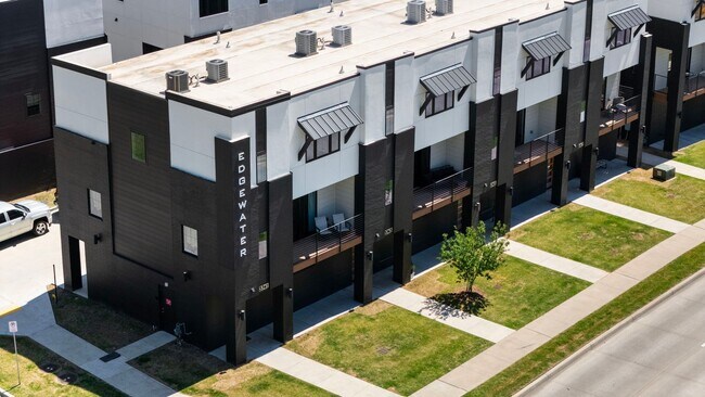 Building Photo - Discover modern elegance in the newly constructed Edgewater Condominiums, a boutique community fe...