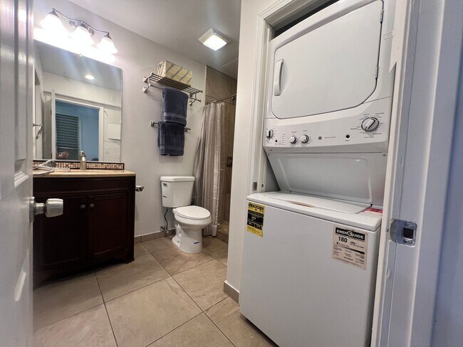 Building Photo - One bedroom semi-furnished bottom floor condo