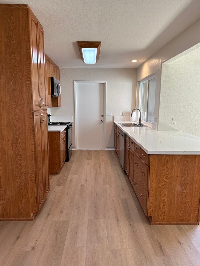 Kitchen View with Door to Attached Garage - 13784 Sycamore Tree Ln
