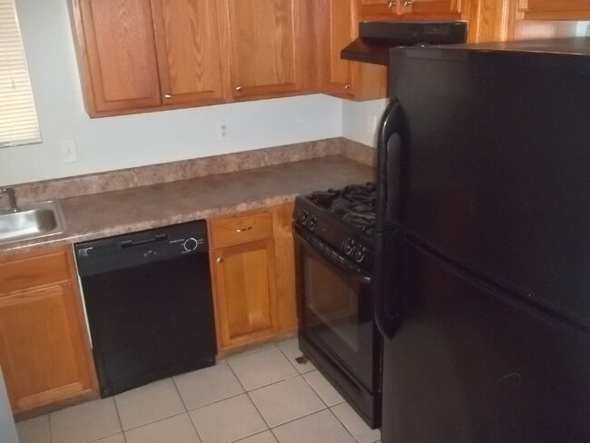 Building Photo - Freshly painted and new flooring in this 4 Bedroom 2 and Half Bath home. Covered front porch with...