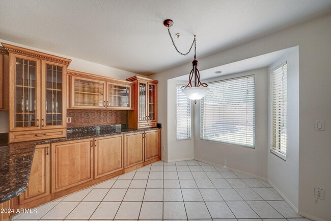 Building Photo - 8804 E Charter Oak Dr