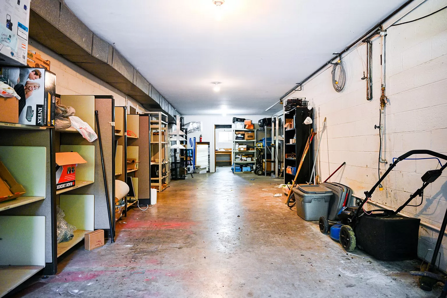 3 Car Garage with lots of storage shelves - 200 Suburban Rd