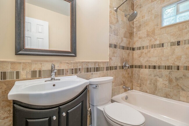 Building Photo - Contemporary, remodeled 920sqft., 3-bedroom, 1-bath single-family ranch with yard