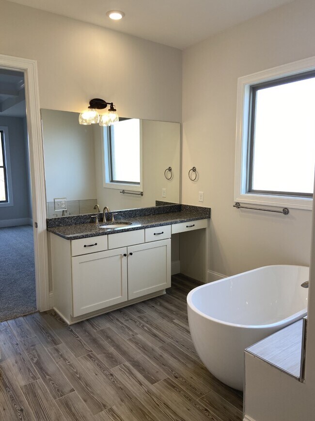 soaking tub with separate shower in primary - 1026 October Park Way