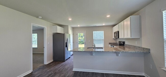 Building Photo - Brand-New Smart Home in the Gated Sandpipe...