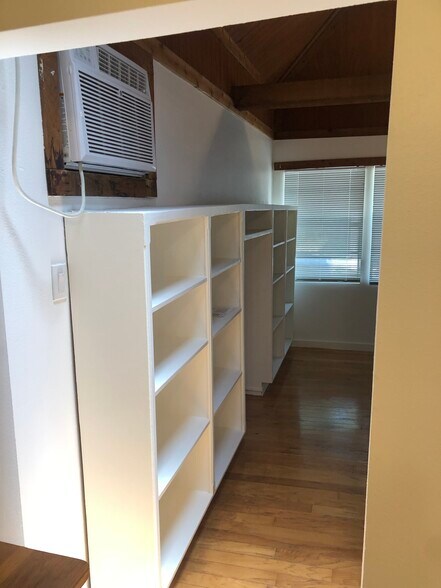 Custom built in bookshelves and A/C unit (cools whole unit efficiently) - 508 Bellevue Pl