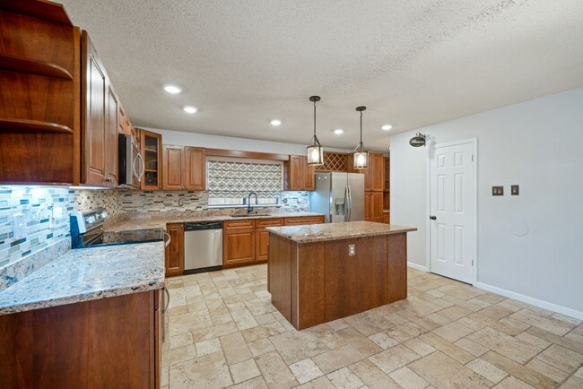 Building Photo - Sign your lease and receive a FREE 50" TV!!!  "Spacious 4-Bedroom Retreat with Fireplace in Charm...