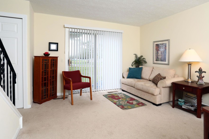 Spacious living rooms - Centennial Village Apartments and Townhomes