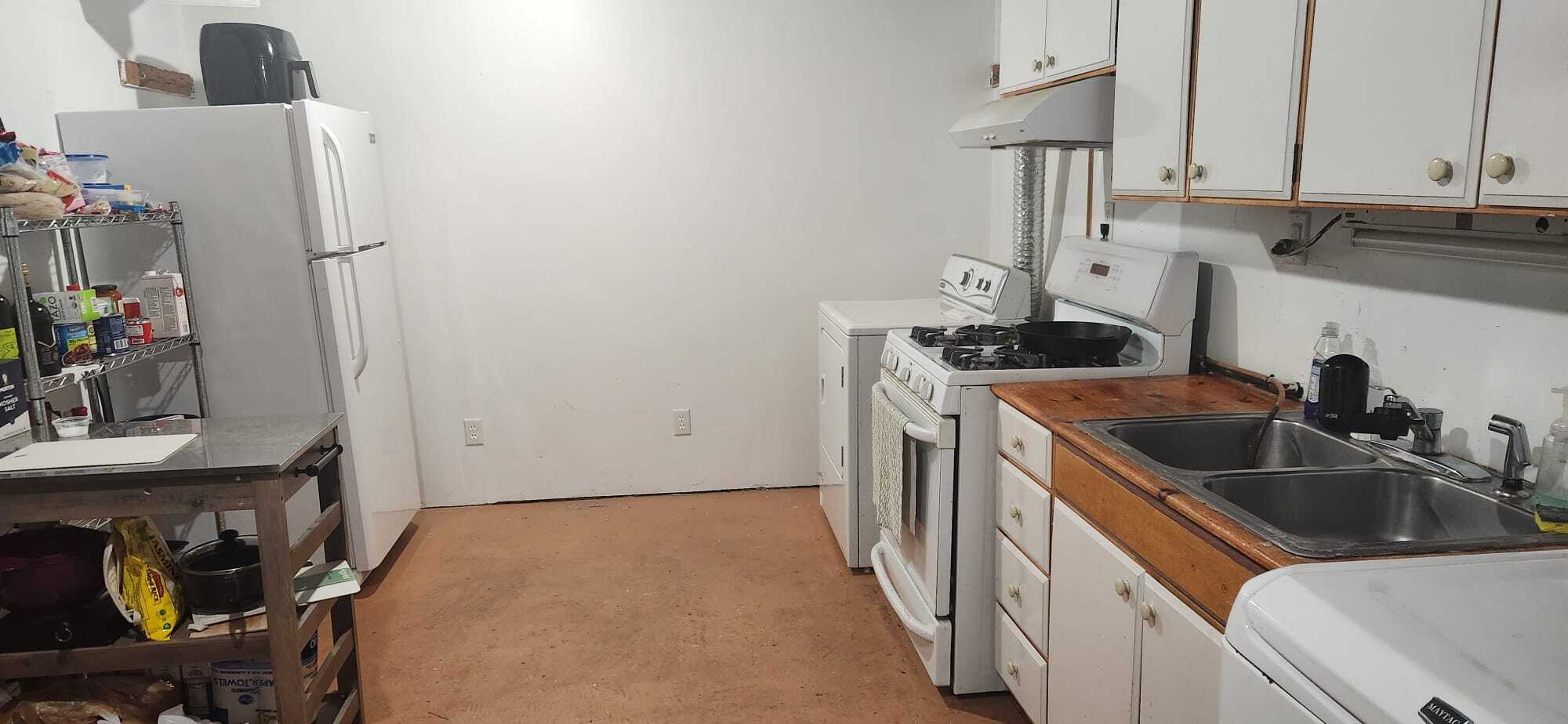 Downstairs Kitchen - Laundry w/view from Bathroom - 2116 Thaler Ave