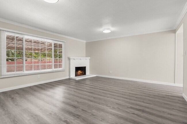 Building Photo - Charming Updated Home With Drive-Through Garage Access
