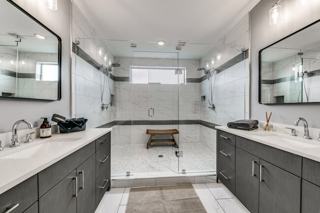 Massive shower with double vanity in the master bath. - 418 Melba St