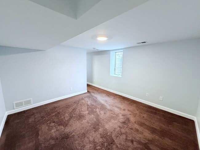 Building Photo - Spacious 4-Bedroom Home with Pond Views & EV-Ready Garage – Bloomington!!