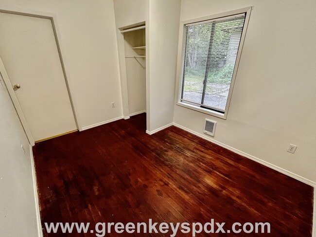 Building Photo - This 3-bedroom 1-bathroom house has a large front yard and a mostly fenced backyard.