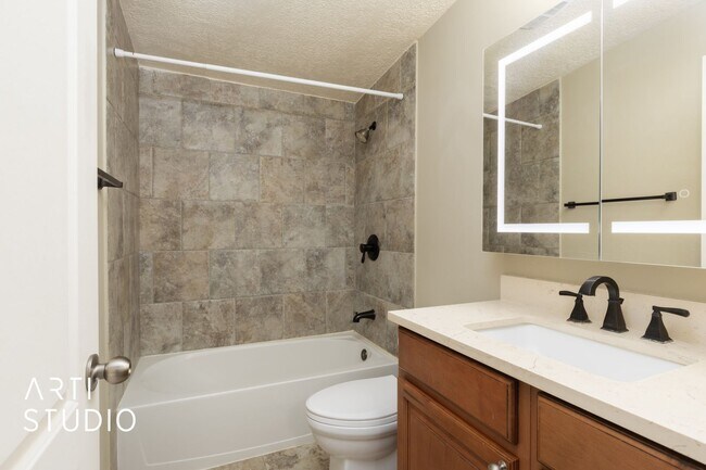 Building Photo - **Stunning 4-Bedroom Home with Modern Amen...