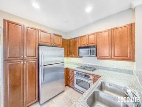 Building Photo - Bright 2BD/2BA Condo in Sabre Springs with Covered Balcony, In-Unit Laundry & Garage