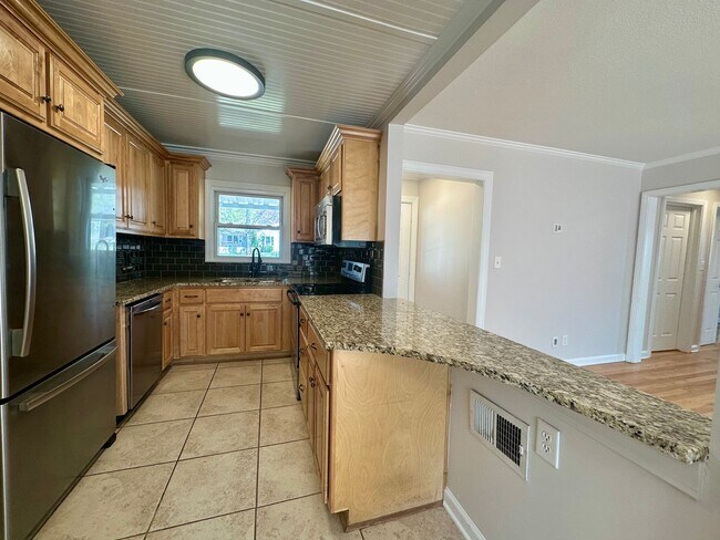 Building Photo - {5221} Updated Prairie Village Ranch + Fenced Yard + One Car Garage