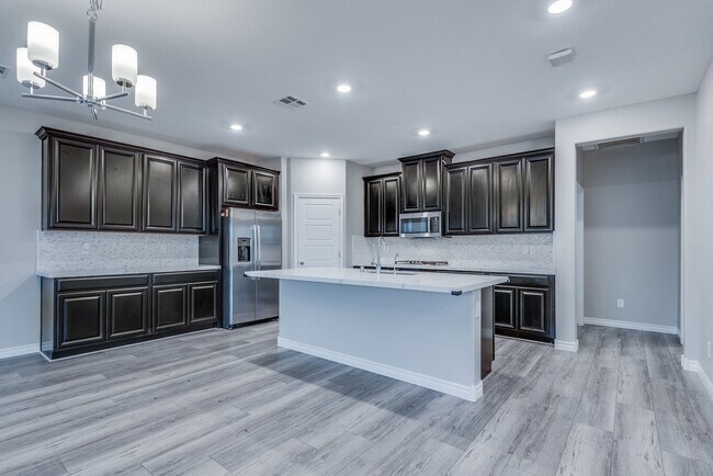 Building Photo - Like new, split-level, 3 bed, 2.5 bath, with bonus room & Strip views in West Las Vegas!