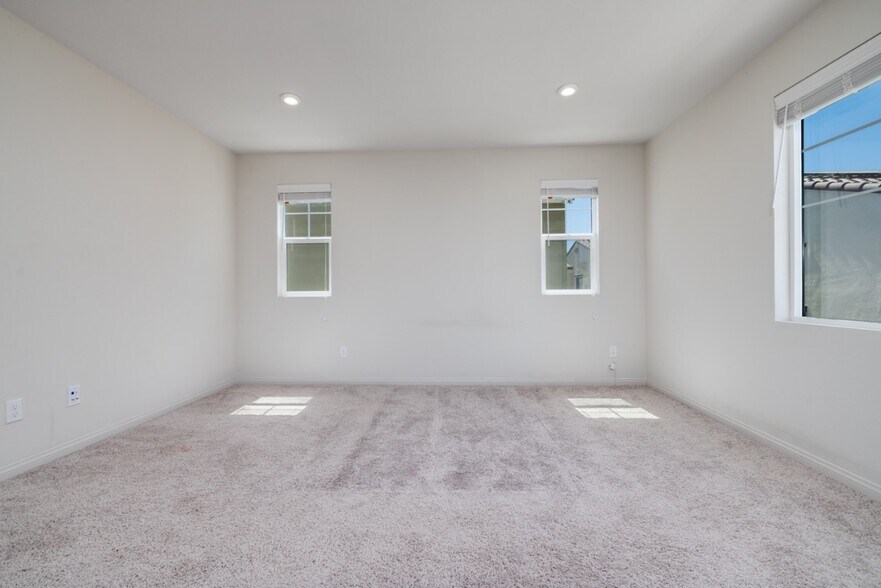 Spacious master bedroom with multiple windows - 26549 Brightstone Dr