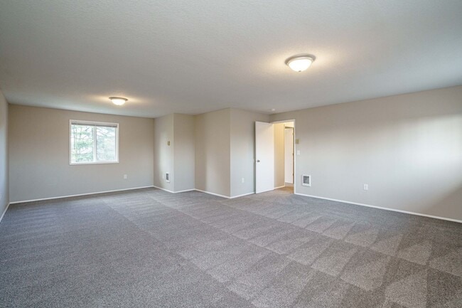 Building Photo - Recently Updated with Wood Laminate Flooring and Fresh Paint
