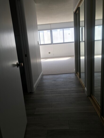 Into bedroom. Bathroom w toilet, shower & bath on left; closets on right - 8701 Delgany Ave