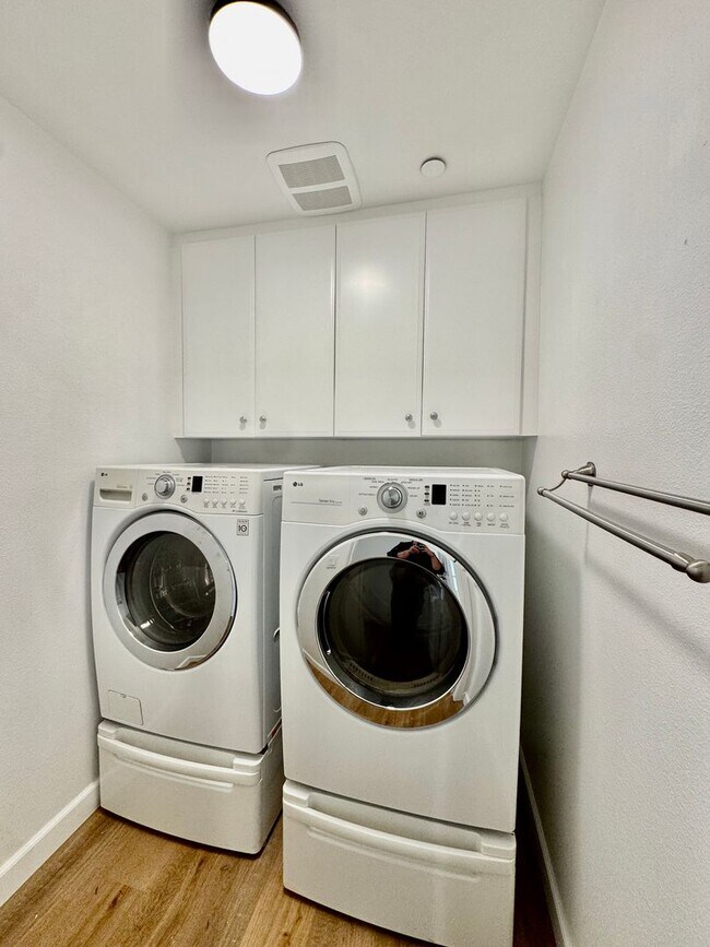 Building Photo - Beautifully Remodel Townhouse with AC & Two Car Garage!