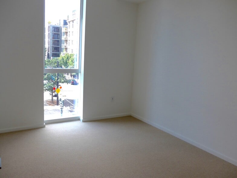 Bedroom with custom-fitted walk-in closet - 1075 NW Northrup