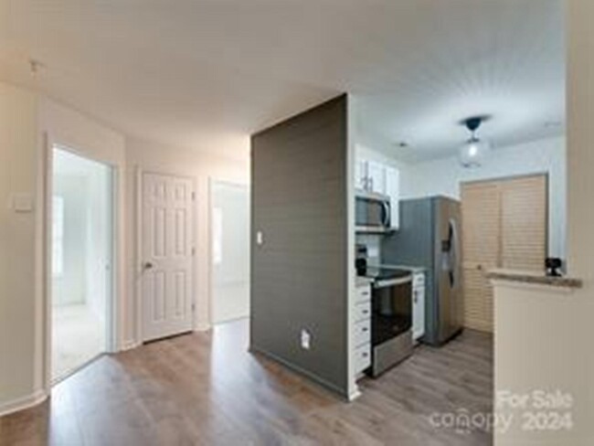 Dining Room Looking at Kitchen & Secondary Bedrooms - 962 Plaza Walk Dr