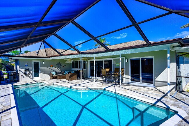 Building Photo - Waterfront Furnished Pool Home with Gulf & Canal Views in Estero Bay Shores