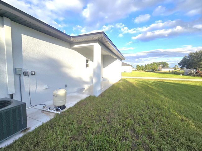 Building Photo - Brand-New 2/2/1 -SW Lehigh Acres-See this ...