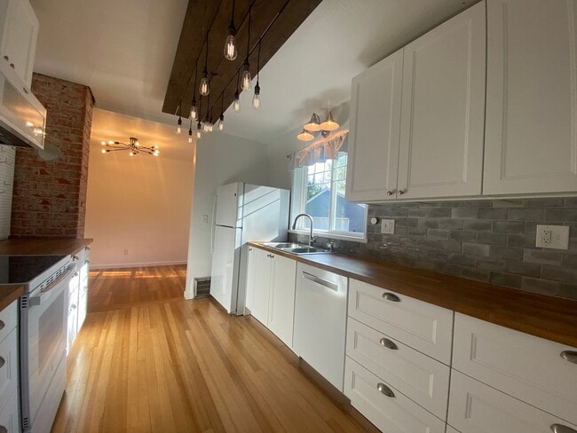 Building Photo - Perry District Gem – Move-In Ready 3 plus Bed / 2 Bath Brick Home with Finished Basement & 2-Car ...