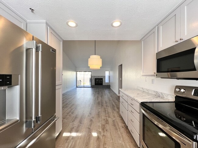 Building Photo - Beautifully Remodeled 2-Bedroom, 2-Bathroom Townhome with Single-Car Garage