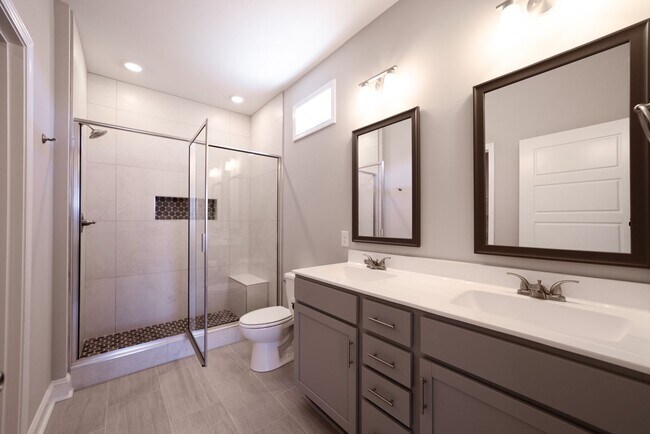 Building Photo - Elegant Home with Stone Fireplace, Kitchen Island and Designer Primary Suite