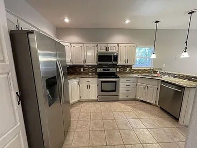 Building Photo - Here is your chance for a fancy 4 bedroom,...